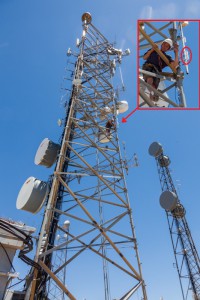Eric KG6WXC installing a mesh network node on Santa Ynez Peak
